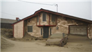 House Covered in Water and Mud from Storm