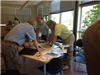 Three Employees Reviewing a Map