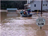 Residents Traveling by Boat During a Flood