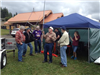 People Gathered by a Tent