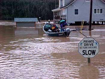 Residents Traveling by Boat During a Flood