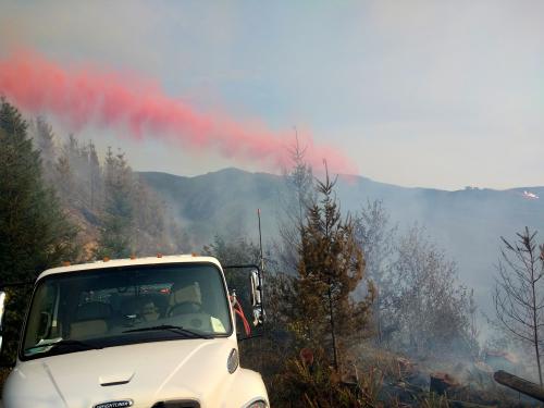Fall Creek Road Fire - White Truck and Red Fire Retardant - July 30, 2018