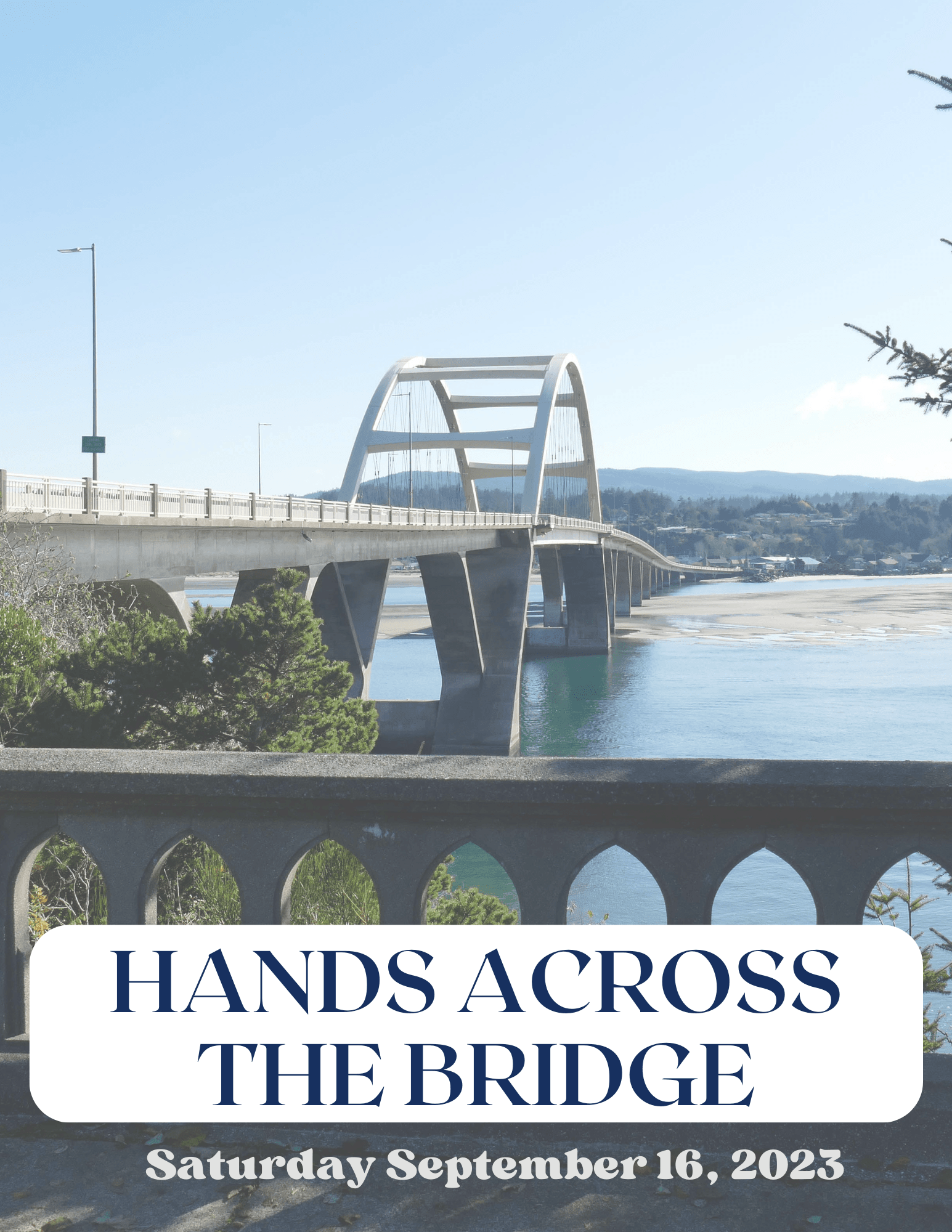 long line of people holding hands on highway 101 Waldport bridge with blue sky in the background 
