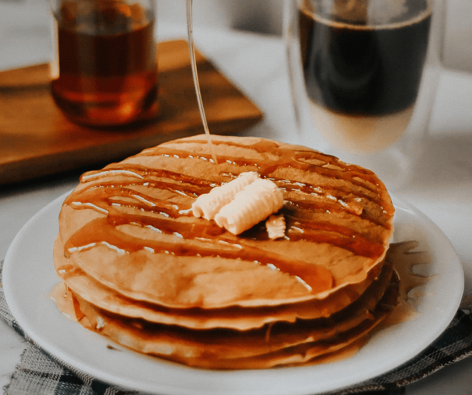 Pancakes with syrup and butter. 